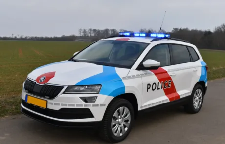 Police car using one of our seat belts for emergency vehicles.